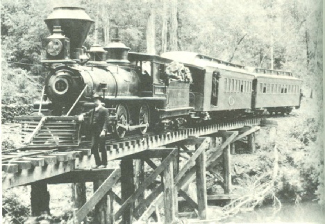 Northwestern Pacific narrow gauge train crossing Austin Creek on the way to Elim Grove.  This is the same train configuration that the scouts would take, c 1920
